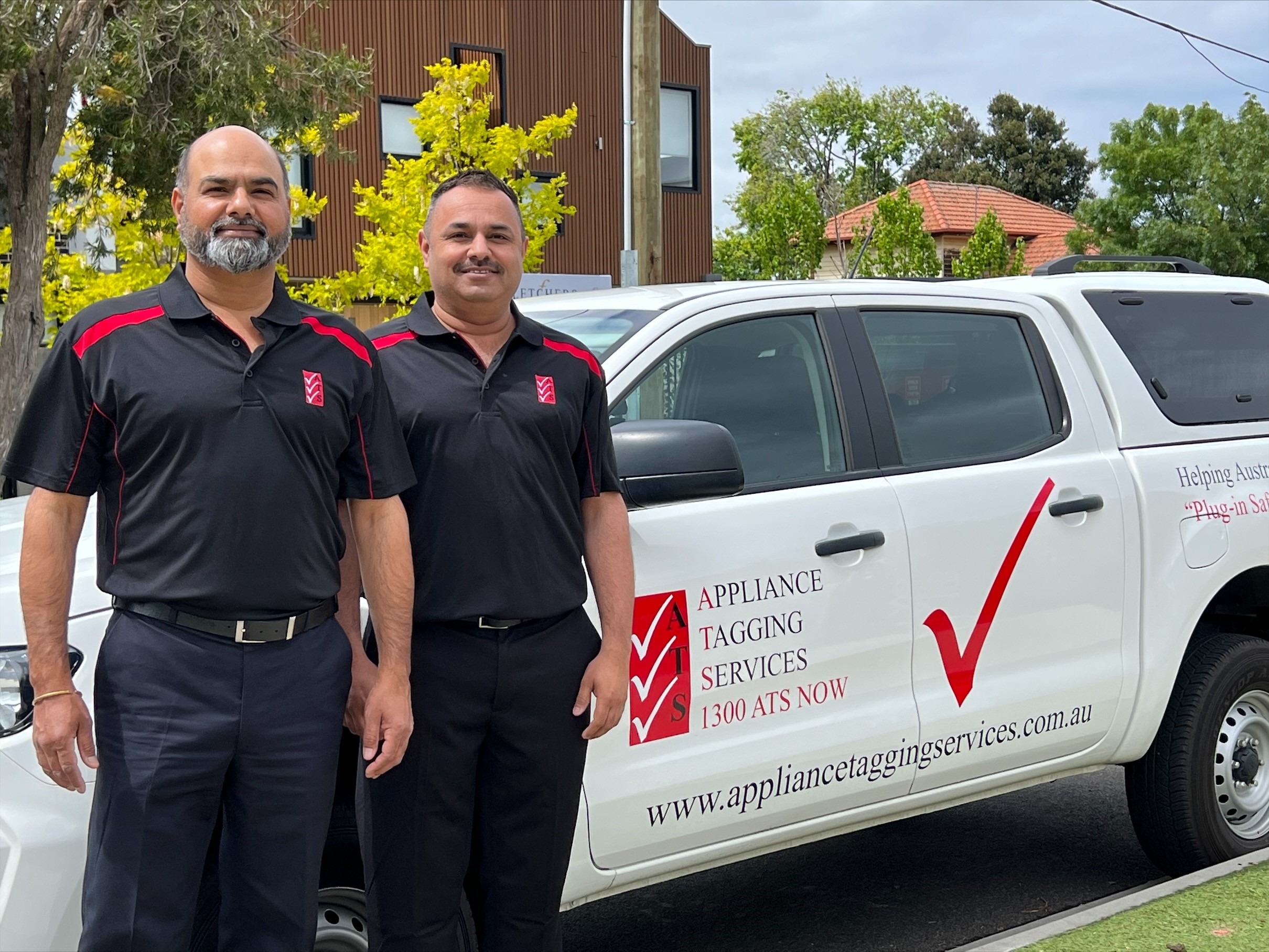 A photo of 2 ATS franchise technicians 